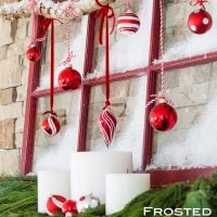 Christmas mantel decorating idea that repurposes an old window sash to create a frosted window pane holiday mantel. #Christmasdecorations #ChristmasDIY, #ChristmasRepurposedDecor #TraditionalChristmasDecorations