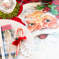 christmas day table setting idea with a Santa and red themed table