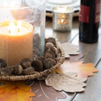 Cut out paper leaves made into a Thanksgiving table centerpiece.