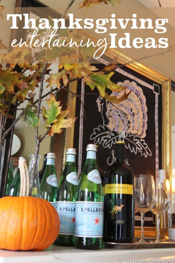 Bar set up on sideboard. Text overlay says Thanksgiving entertaining ideas.