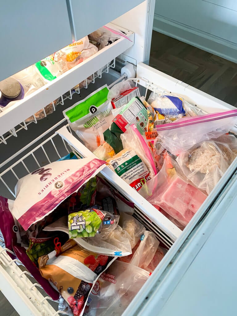 bottom drawer of a freezer before getting organized.