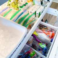 open bottom freezer drawer showing the addition of dividers to organize contents into sections.