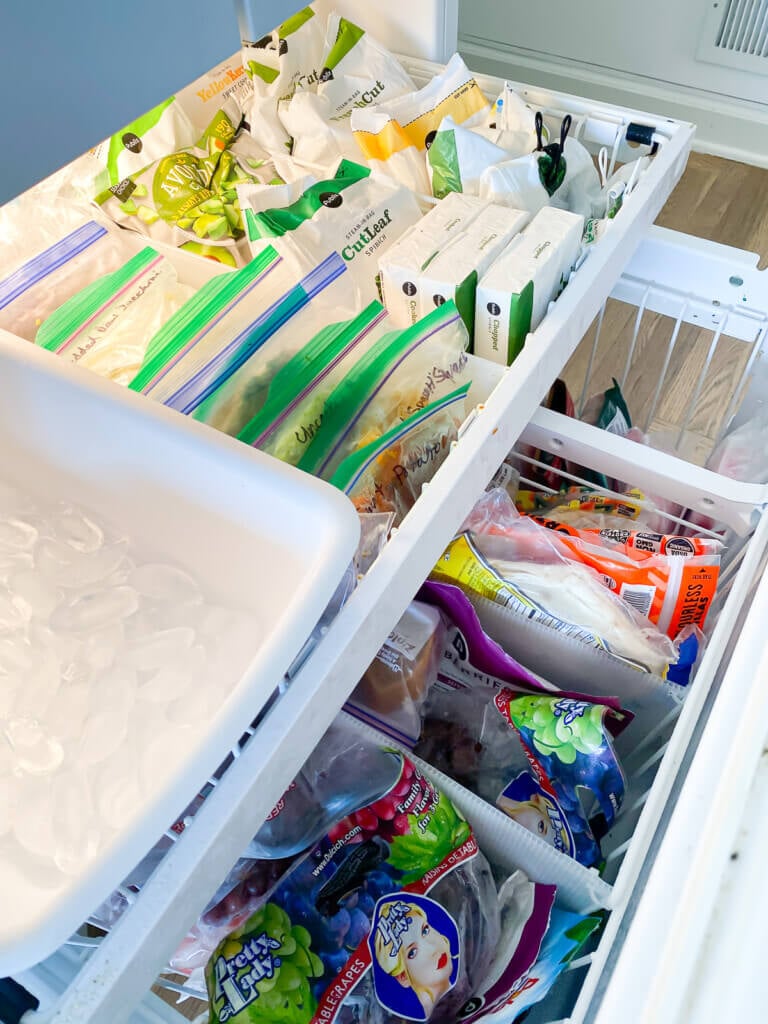 open bottom freezer drawer showing the addition of dividers to organize contents into sections.