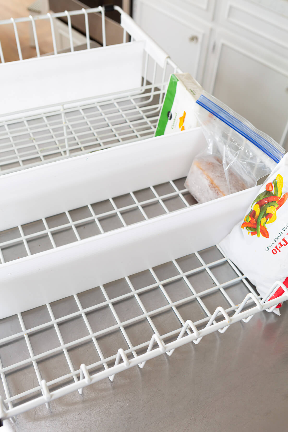 Measure for freezer divider placement using the actual contents in the freezer.