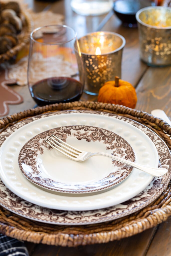 brown and white plates on a dining table