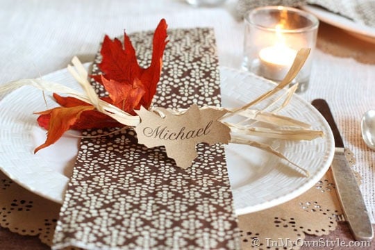 Rustic leaf place card on Thanksgiving table setting