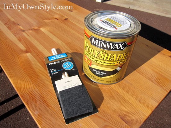 Minwax PolyShades Stain and Polyurethane in 1 Step and a foam paint brush on pine table.