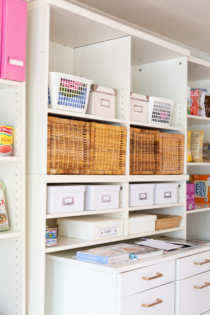 Vintage IKEA storage baskets and boxes in a shelving unit.