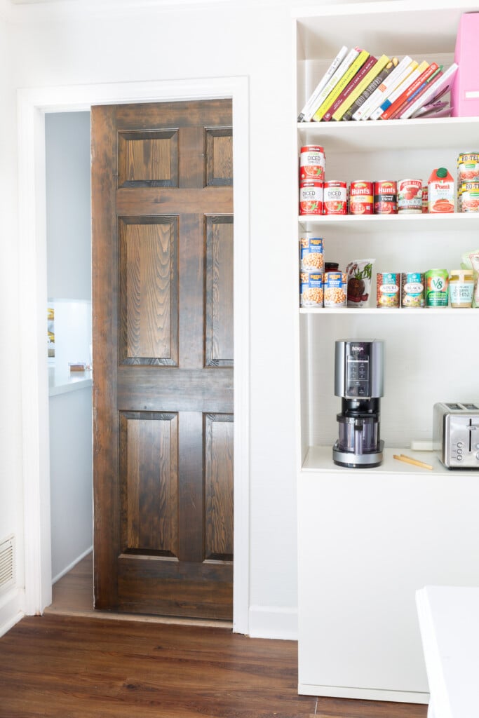 Looking at a Pocket door from inside the room being changed to a kitchen storage area.