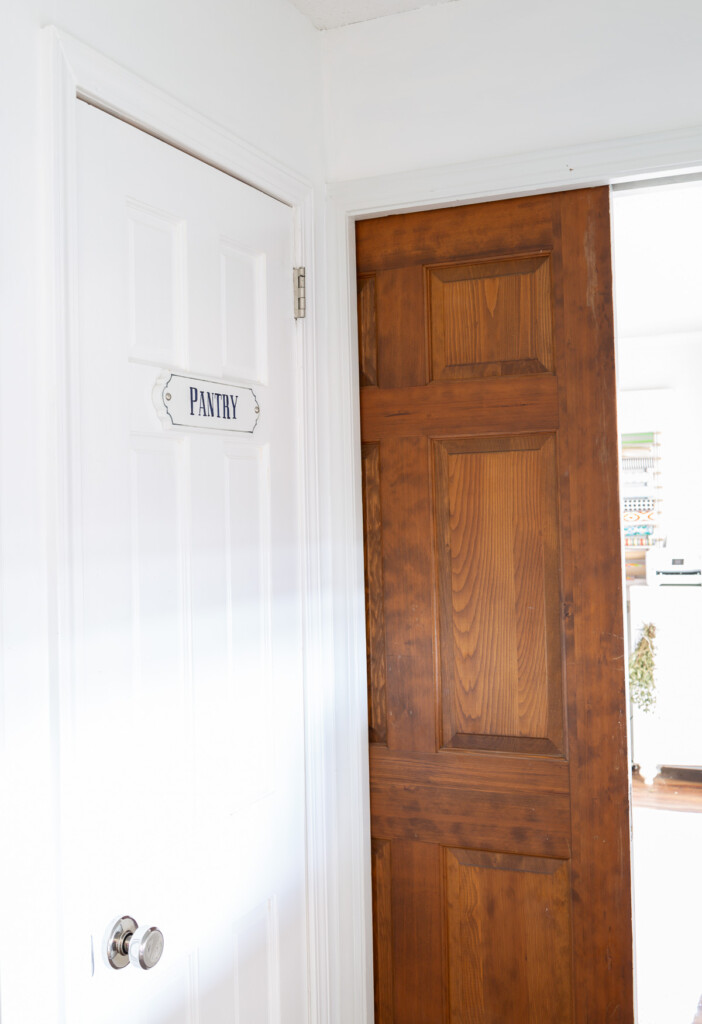 Wood pocket door in the entrance to storage Butler's pantry space.