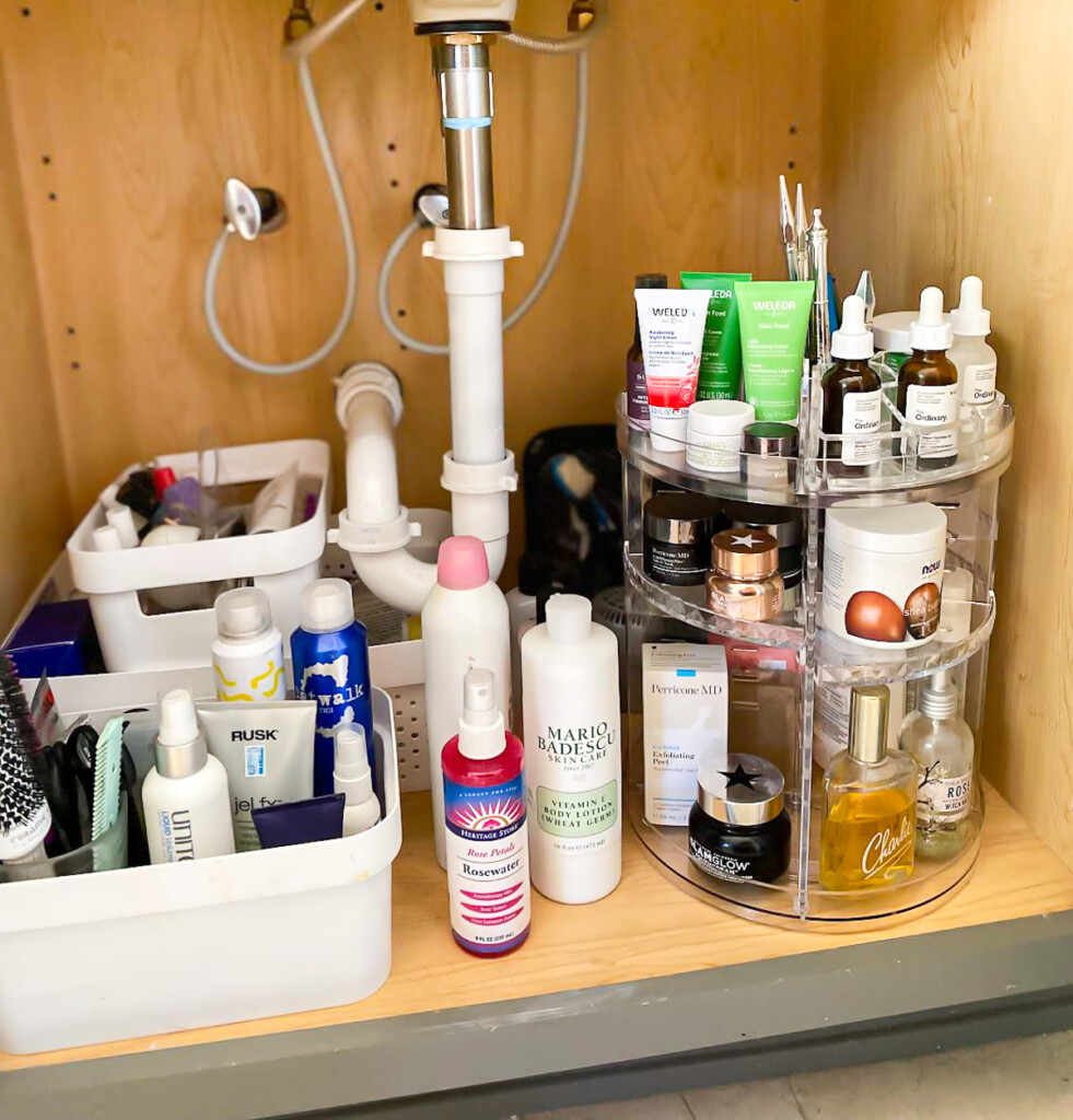 Under a bathroom sink 3 tier rotating bathroom organizer.