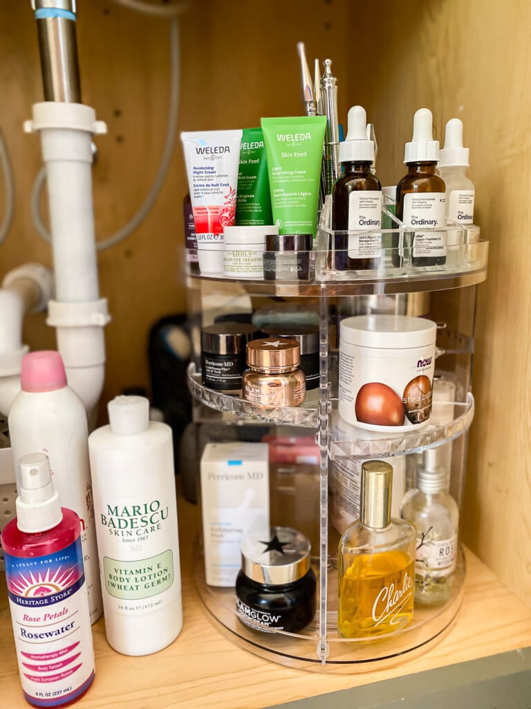 Under a bathroom sink rotating bathroom organizer.