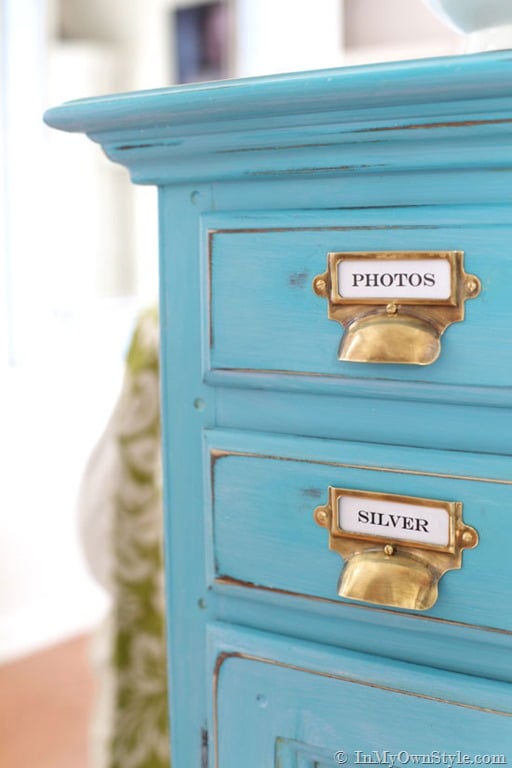 turquoise chalk painted sideboard with aged brass card catalog style pulls.